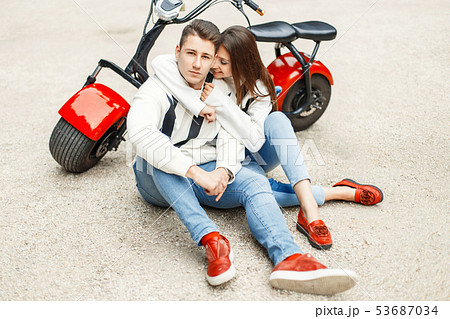 Fashionable beautiful couple in jeans clothes Fashionable beautiful couple in jeans clothes 53687034