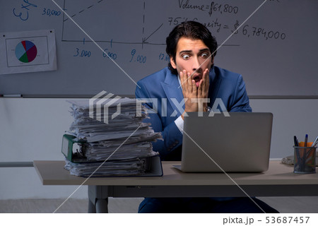 Young elegant financial specialist working in the office night t 53687457