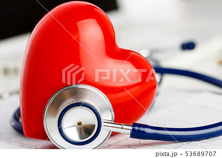 Medical stethoscope head and red toy heart 53689707