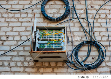 Fiber Optic Patch Panel On Apartment Building Wall 53690582