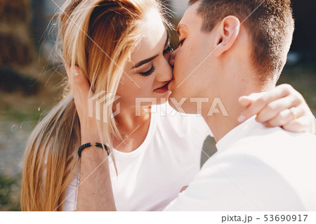 Beautiful couple spend time in a summer city Beautiful couple spend time in a summer city 53690917