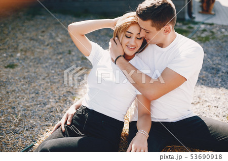 Beautiful couple spend time in a summer city Beautiful couple spend time in a summer city 53690918