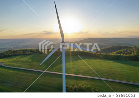 Wind turbines at sunset taken from the drone Wind turbines at sunset taken from the drone 53691053