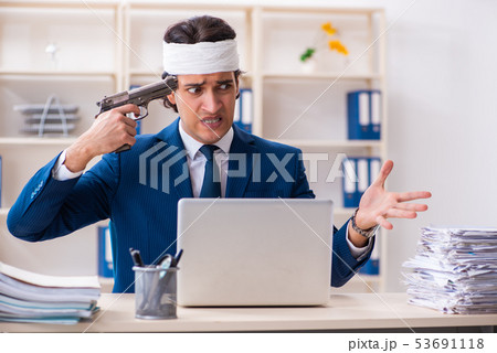 Head injured male employee working in the office Head injured male employee working in the office 53691118