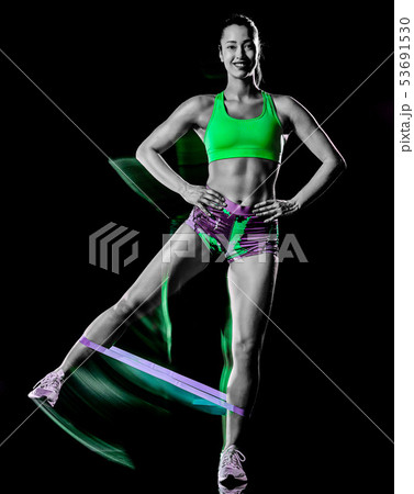 woman exercising fitness exercises isolated black background lightpainting effect 53691530