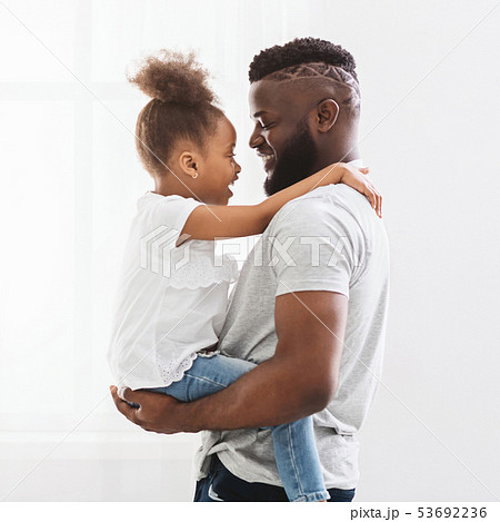 Dad hugging his little daughter at home 53692236