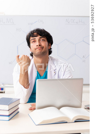 Young student chemist in the classroom Young student chemist in the classroom 53692927