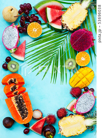 Assortment of tropical exotic fruits. Blue background. Copy space. Top view. 53696038