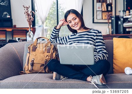 Asian teenager girl using laptop computer and 53697205