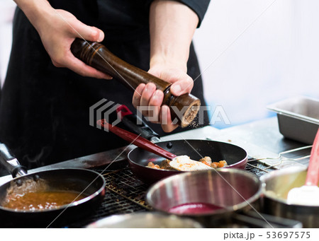 Chef cooking food in the kitchen, Chef preparing Chef cooking food in the kitchen, Chef preparing 53697575