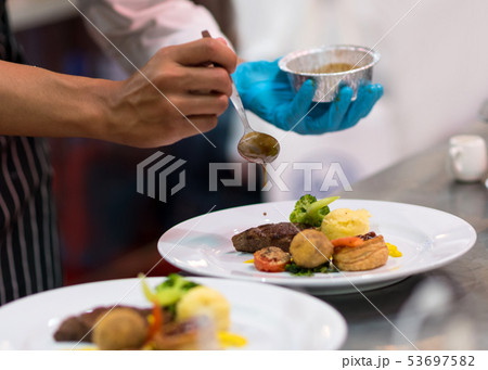 Chef cooking food in the kitchen, Chef preparing 53697582