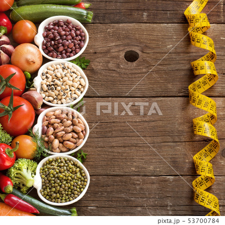 Legumes in bowls and vegetables 53700784