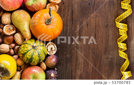 Autumn border on a wooden table 53700785