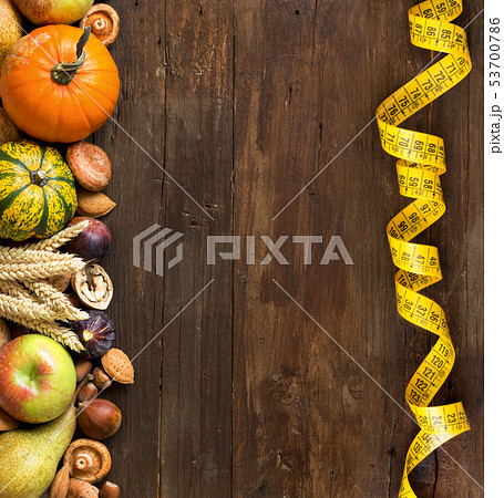 Autumn border on a wooden table 53700786