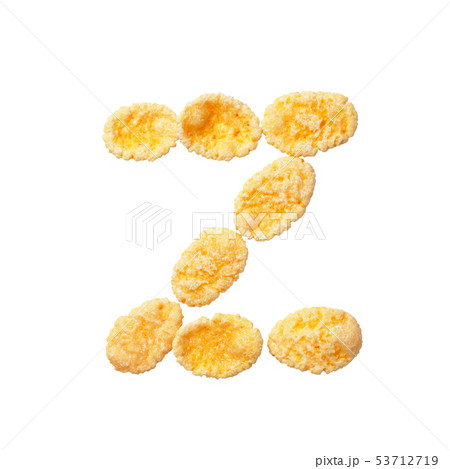 Yellow cornflakes letter Z isolated on white background. Alphabet cereal flakes 53712719