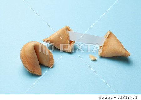 Chinese fortune cookies. Cookies with empty blank inside for prediction words. Blue background. Chinese fortune cookies. Cookies with empty blank inside for prediction words. Blue background. 53712731