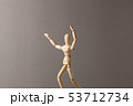 Man stretches his hand up on gray background. 53712734