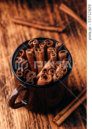 Cinnamon sticks in a metal mugr Cinnamon sticks in a metal mugr 53712829