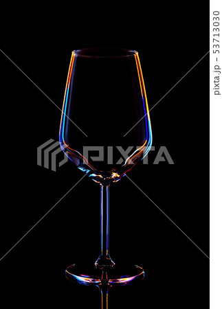 Glass for wine on a black background, multi-colored contours. Glass for wine on a black background, multi-colored contours. 53713030