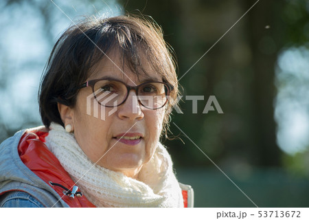 portrait of middle-aged woman in the spring sun portrait of middle-aged woman in the spring sun 53713672