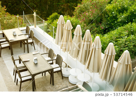 A cozy wicker table in the outdoor cafe-bar on the rooftop in the morning, 53714546