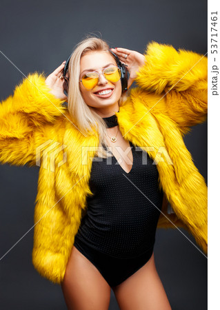 Happy young woman in headphones listening to music 53717461
