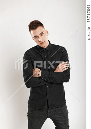 Young handsome man in a black shirt in the studio 53717841