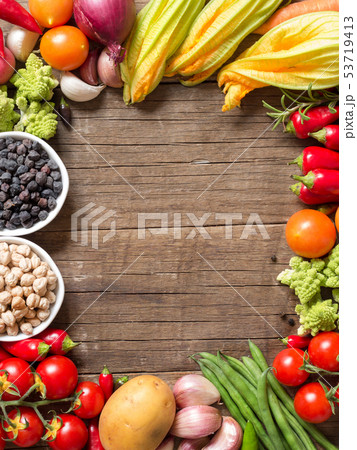 Vegetables and chickpea on a wooden table Vegetables and chickpea on a wooden table 53719413