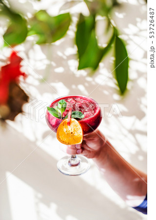 summer mocktail in the hand 53726487