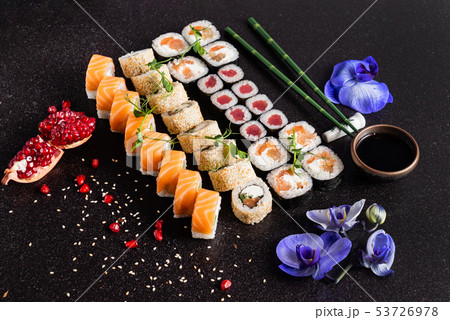 Rainbow Sushi Roll with salmon, eel, tuna, avocado, royal prawn, cream cheese Philadelphia 53726978