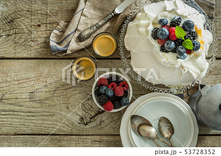 Pavlova with berries and coffee Pavlova with berries and coffee 53728352