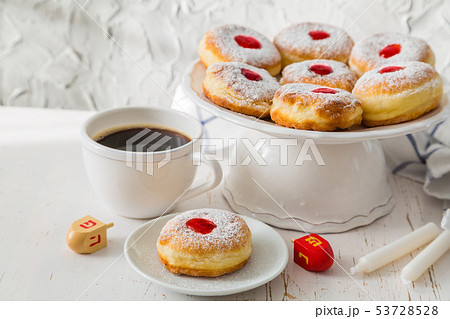 Symbols of Hanukkah celebration on wood background 53728528