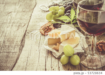 Appetizer - cheese wine grapes nuts 53728634