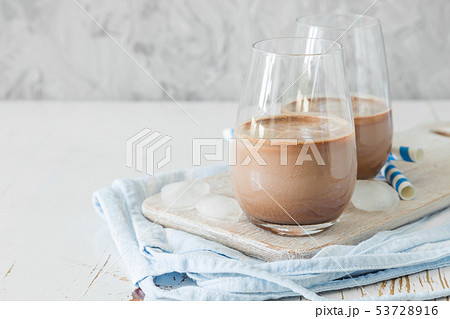 Chocolate milk in glasses 53728916
