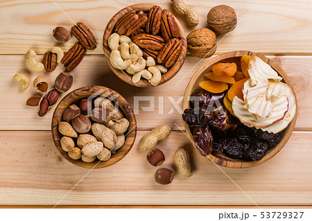 Selection of dried fruits and nuts as symbols Tu Bishvat Selection of dried fruits and nuts as symbols Tu Bishvat 53729327