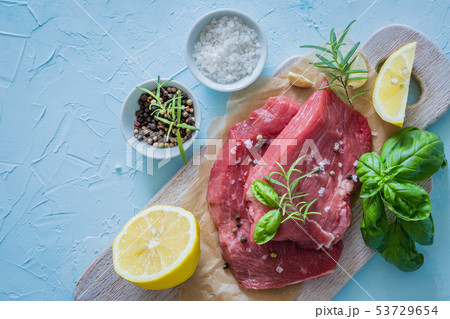 Raw meat with herbs, lemon, garlic, salt 53729654
