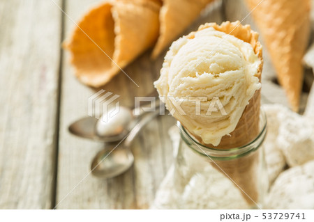 Vanilla ice cream in waffle cone 53729741