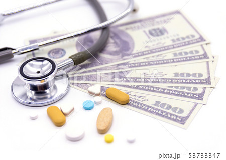 Stethoscope with dollar bank and medicine capsules 53733347