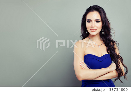 Cheerful woman with diamond necklace and earrings 53734809