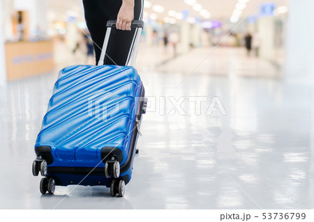 Traveler women and luggage at airport terminal 53736799