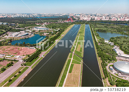 Rowing canal illuminated by bright sunshine. Panoramic view. Shooting from above, aerial filming 53738219