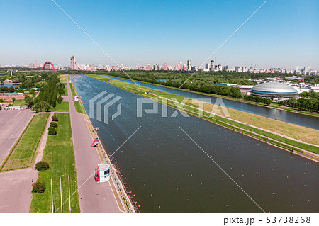 Rowing canal illuminated by bright sunshine. Panoramic view. Shooting from above, aerial filming 53738268