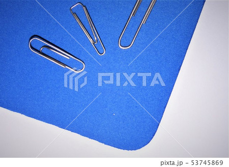 paperclips on blue background closeup paperclips on blue background closeup 53745869
