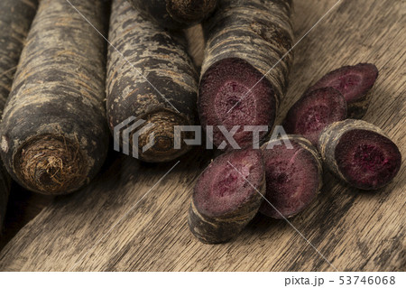 chopped red carrot on a wooden table chopped red carrot on a wooden table 53746068