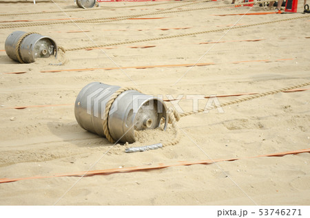 Sports competition with a barrel and a rope on the 53746271