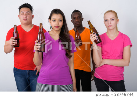 Studio shot of diverse group of multi ethnic friends holding bot 53746744