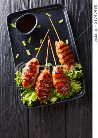 Tsukune Japanese chicken meatballs, skewered and Tsukune Japanese chicken meatballs, skewered and 53747480