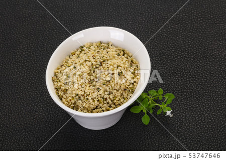 Peeled hemp seeds in the bowl Peeled hemp seeds in the bowl 53747646