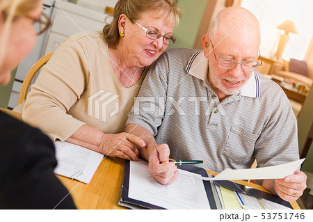 Senior Couple Going Over Signed Documents  53751746