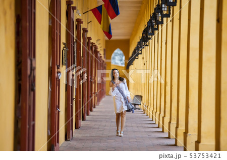 Beautiful woman walking around the walled city in 53753421